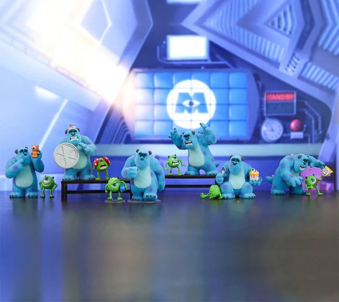 Toy figures of monsters in a futuristic setting with blue and green colors.