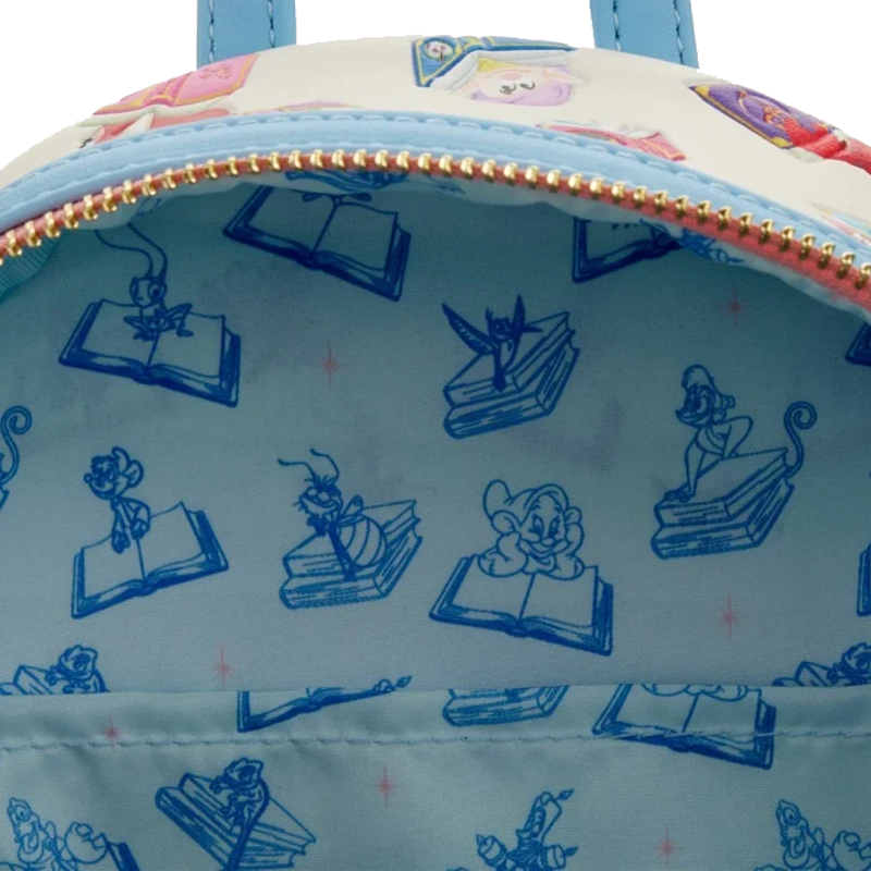 Close-up of a lining of Disney Princess Books Classics Loungefly Mini Backpack with princess side kicks character illustrations on a light blue background.