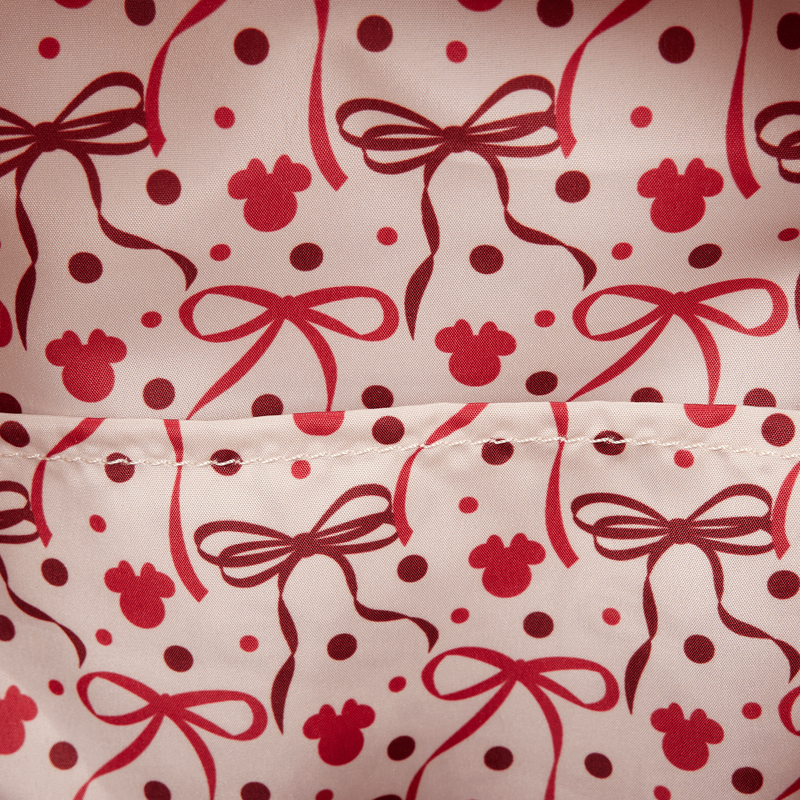 Interior lining pattern of red bows and Minnie mouse silhouettes prints on a white background