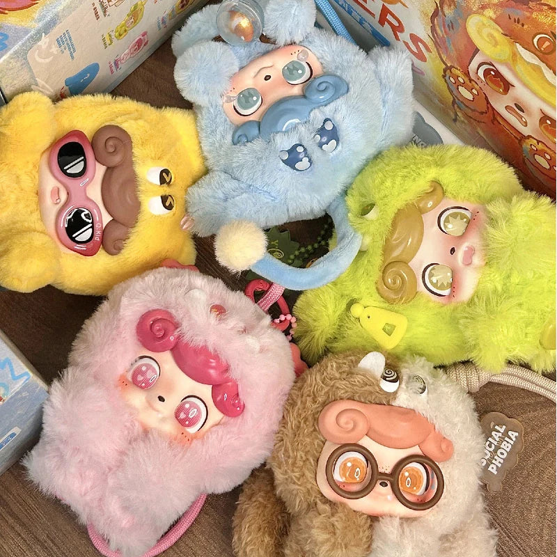 Colorful Q Kid emotional hairy monsters plush toys with unique designs on a wooden surface