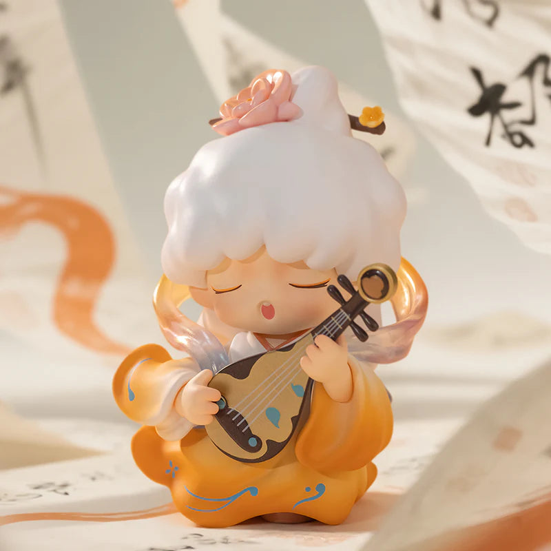 Yumo figurine of a character with white hair and orange outfit playing a stringed instrument on a light background.