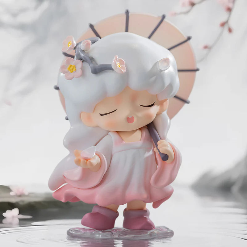 Cute yumo figurine with white hair and pink dress holding a fan, with cherry blossoms in the background.