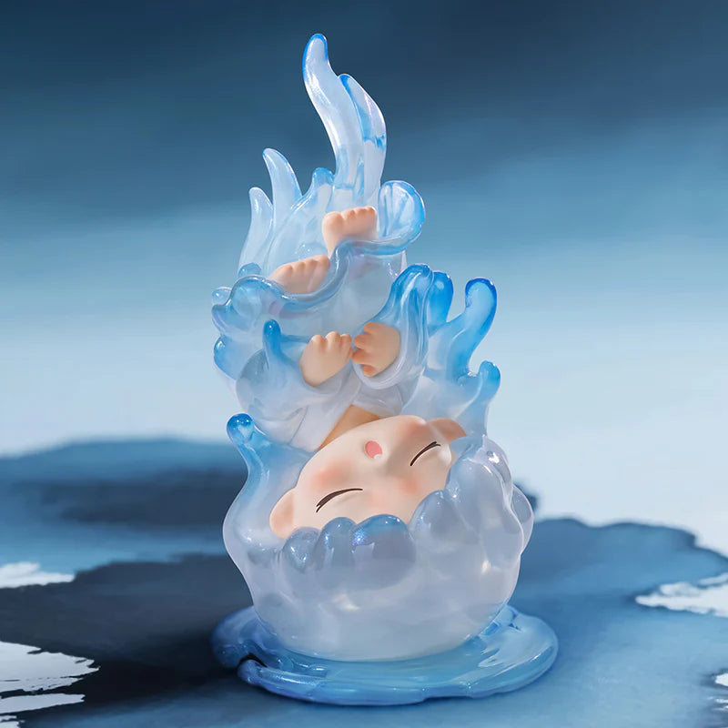Yumo figurine of a baby encased in ice with blue flames on a blue background