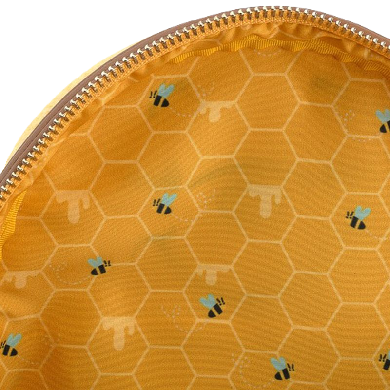 Disney Winnie the Pooh Loungefly fabric lining like honeycomb pattern and bees on a yellow background