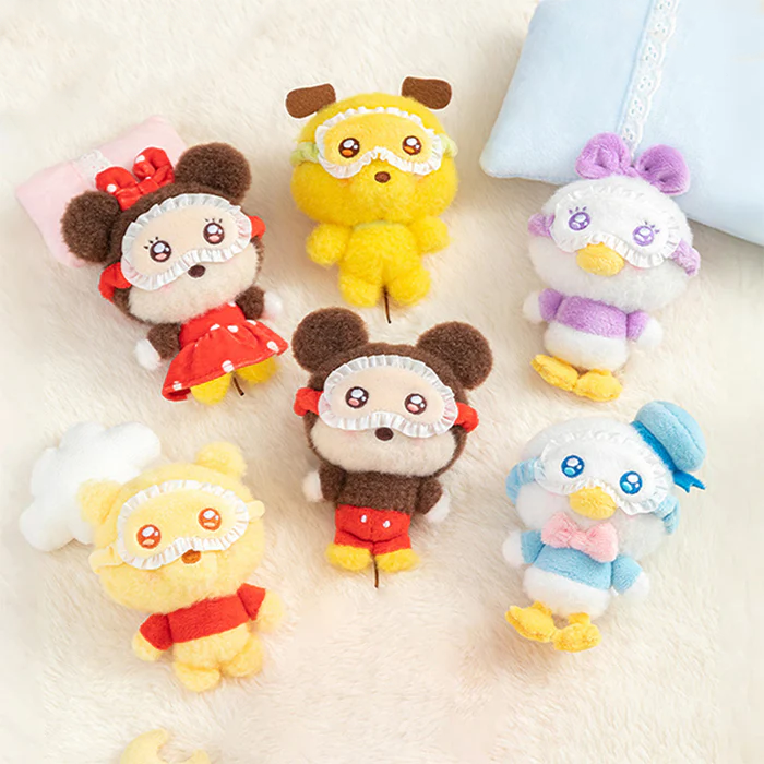 Set of Disney squinting sleepwear plushies bag charm featuring Pluto, Mickey Mouse, Minnie Mouse, Daisy, Winnie The Pooh and Donald Duck on a light background