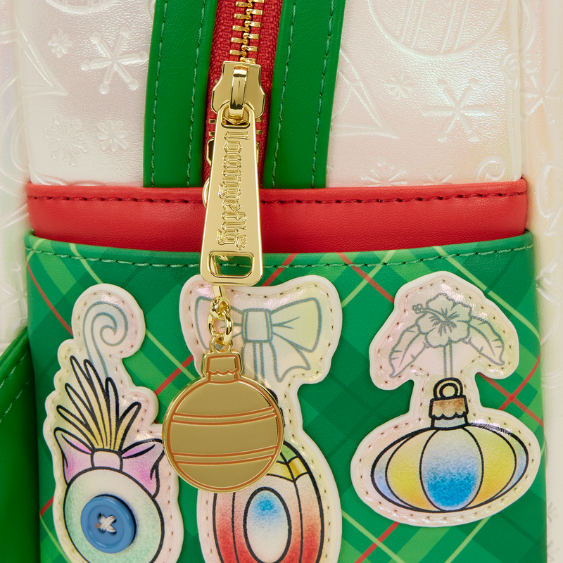 Green Loungefly bag with colorful designs and a gold christmas ball charm on a white background