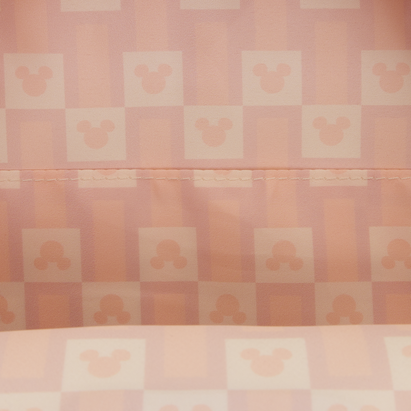 Checkered pattern with a stylized mickey silhouette design on a pink background