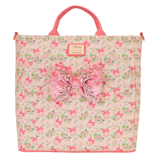 Pink floral Minnie Mouse Loungefly bag with a large bow on a white background