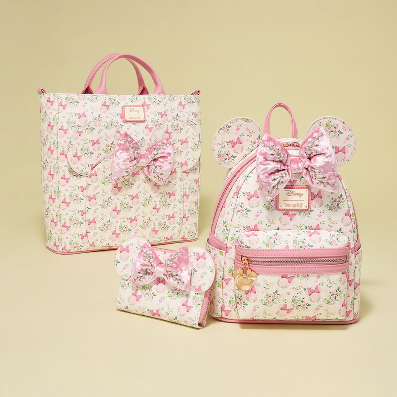 Set of floral Minnie Mouse Loungefly bags with pink bows on a beige background