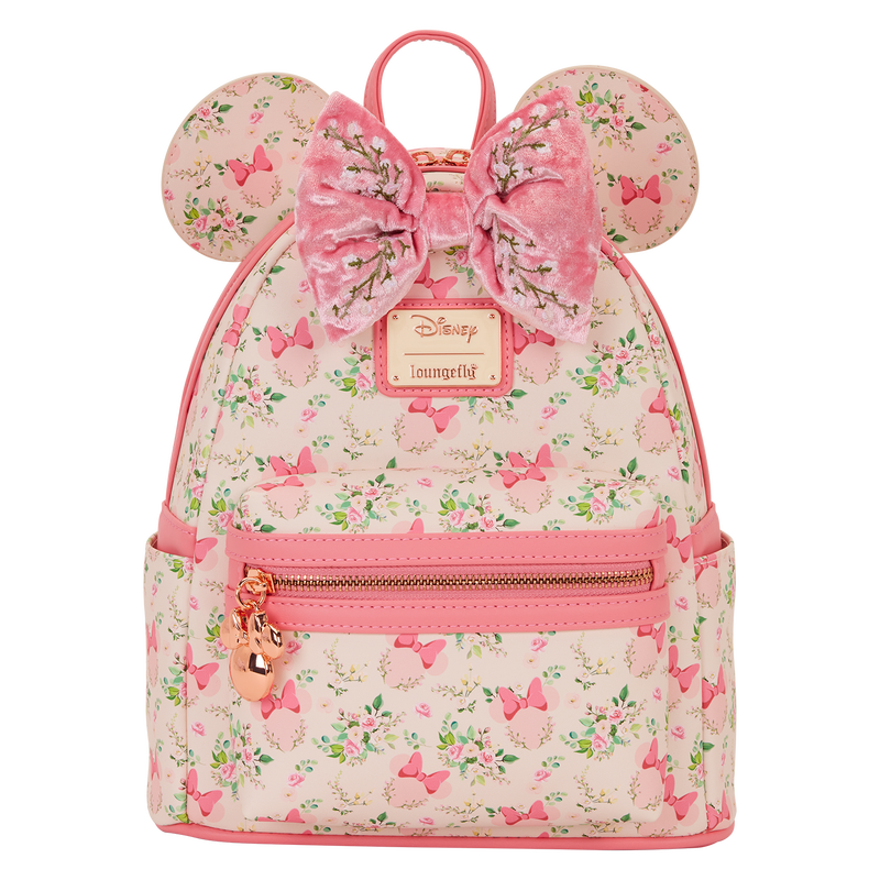 Pink Minnie Mouse Loungefly backpack with floral pattern and bow design on a white background
