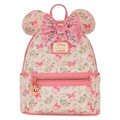 Pink Minnie Mouse Loungefly backpack with floral pattern and bow design on a white background