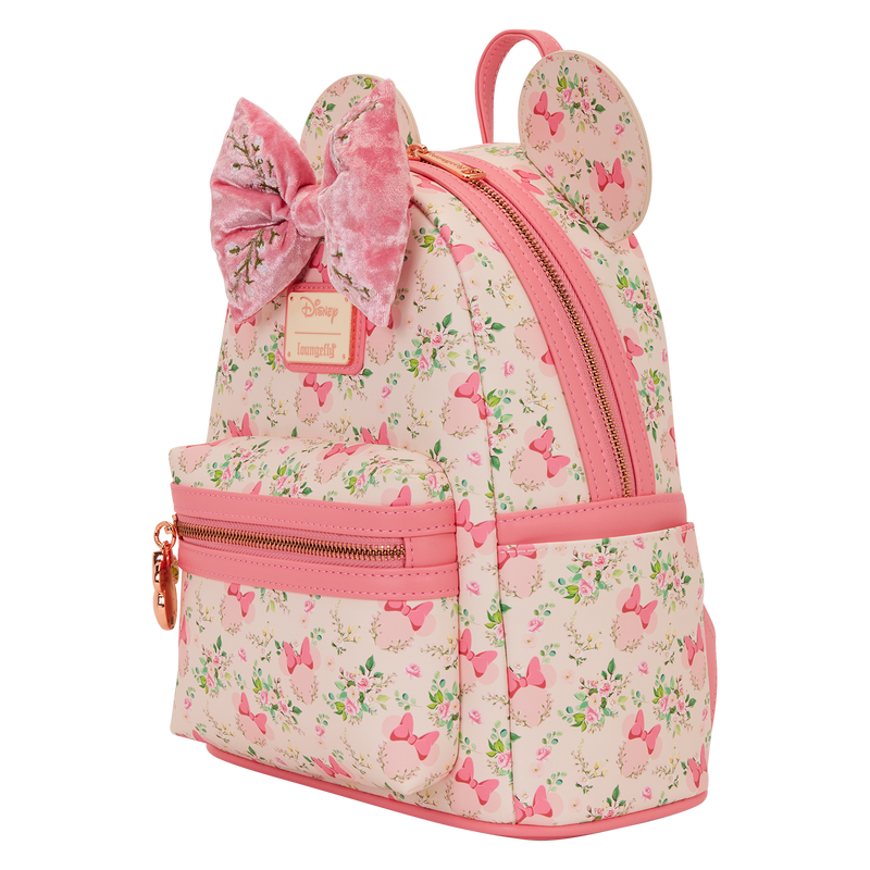 Pink Minnie Mouse Loungefly backpack with floral pattern and bow design on a white background