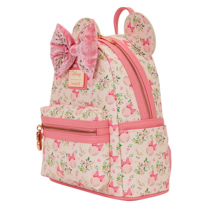 Pink Minnie Mouse Loungefly backpack with floral pattern and bow design on a white background