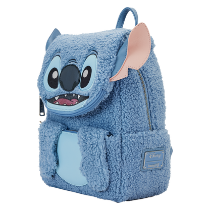 Blue plush Loungefly backpack shaped like Stitch with a white background