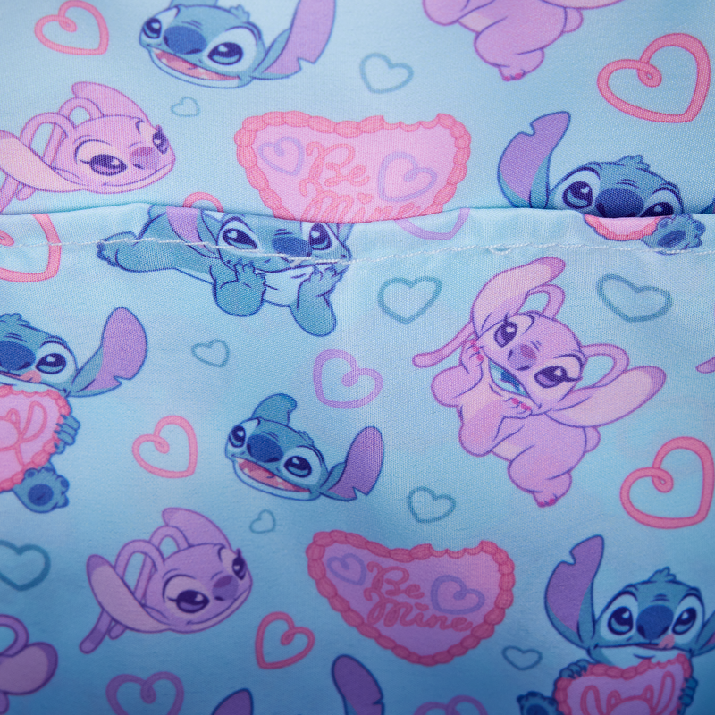 Patterned fabric with Stitch & Angel and hearts on a light blue background