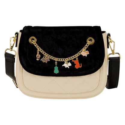 Black and beige handbag with Aristocats characters charm chain on a white background