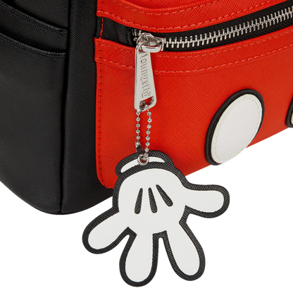 Keychain shaped like a Mickey hand attached to a red bag.