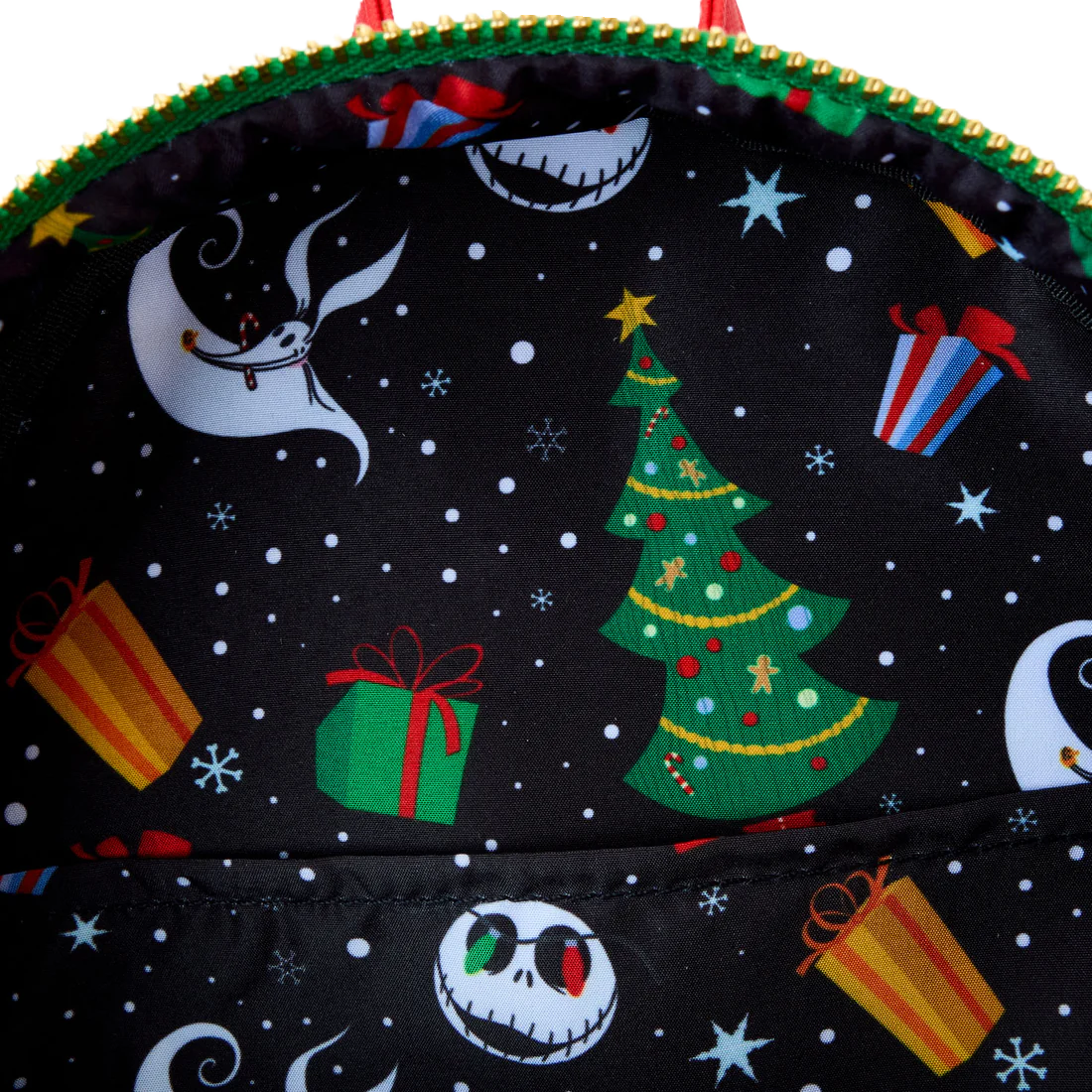 Loungefly backpack with Christmas-themed Jack Skellington design featuring a tree, presents, and moon.
