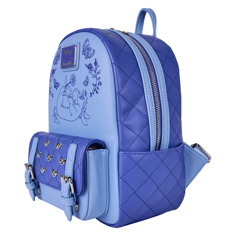Blue backpack with quilted eeyore design and butterfly details on a white background