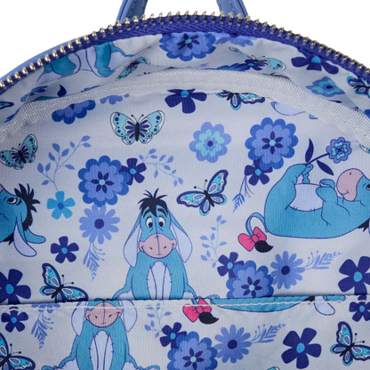 Backpack with Eeyore  design featuring blue flowers and butterflies.
