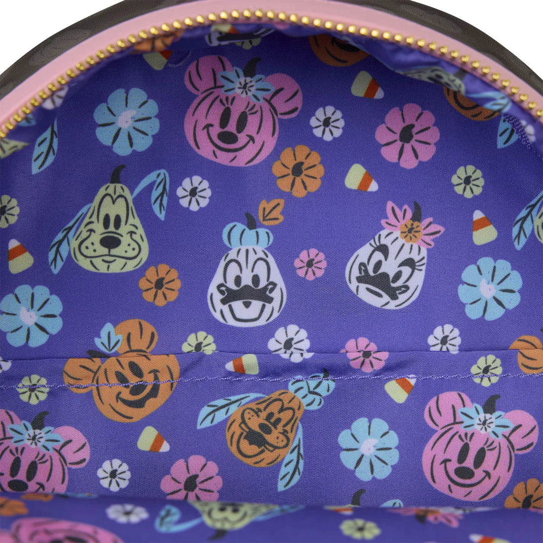 Close-up of a purple fabric with Pluto, Minnie Mouse, Goofy, Daisy & Donald Duck and floral pattern on a white background