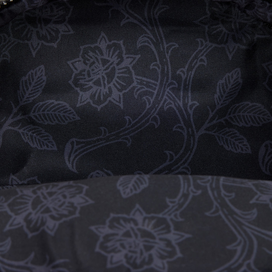 Dark fabric with subtle floral pattern
