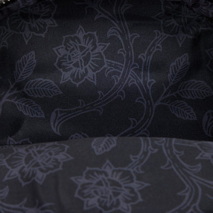 Dark fabric with subtle floral pattern