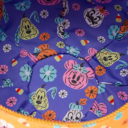 Colorful fabric with Minnie Mouse & Pluto and floral patterns on a purple background