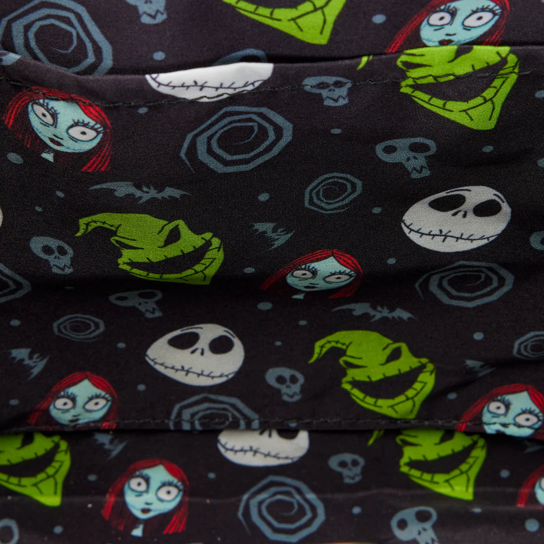 Bag lining with Halloween-themed designs including Jack, Sally and Oogie boogie on a dark background.