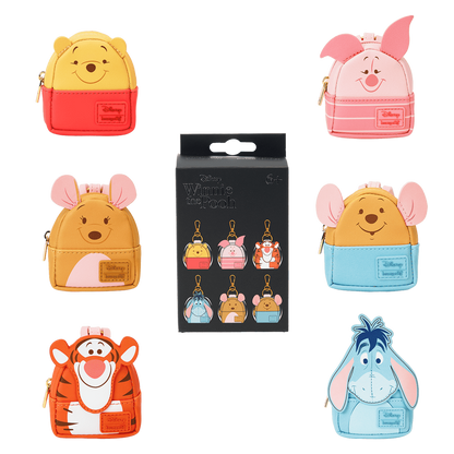 Collection of Winnie the Pooh themed loungefly bag charms on a white background.