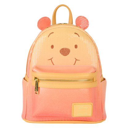 Orange Winnie the Pooh Loungefly backpack with bear face design on a white background
