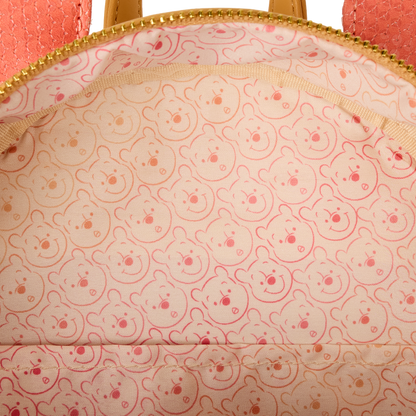 Close-up of a Winnie the Pooh Loungefly  bag with Winnie pattern