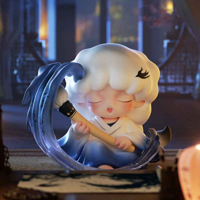 Yumo figurine of a character with white hair and a blue outfit, holding a staff, in a warm indoor setting.