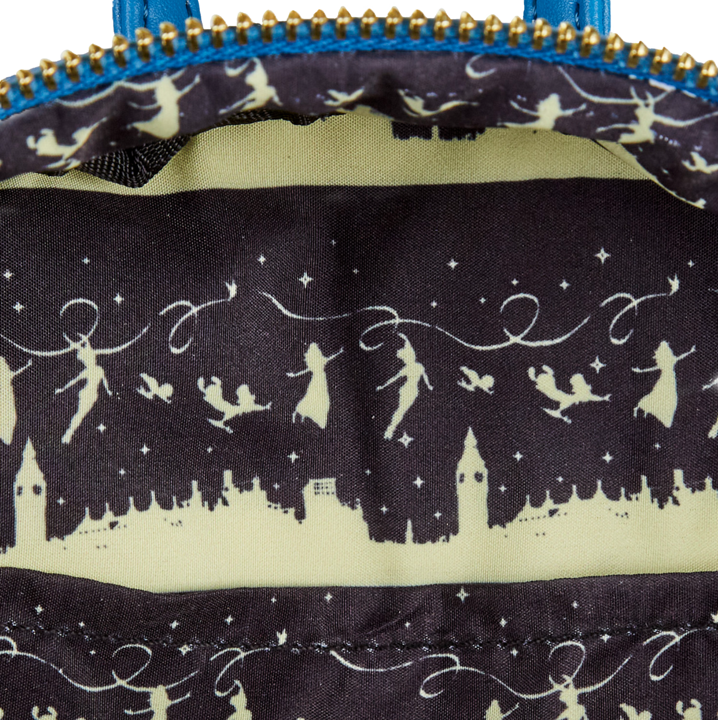 Close-up of a Peter Pan Loungefly backpack interior lining with Peter Pan, Wendy and the kids silhouettes on a dark background